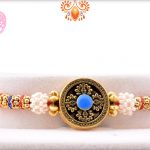 Exclusive Designer Golden Rakhi With Flower Of White Pearls