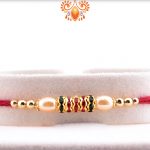 Royal Combination Of Gold And White Pearl Beads Rakhi 4
