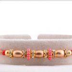 Beautiful Pink Pearl Ring with Oval Golden Beads Rakhi 3