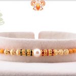 Delicate White Pearl With Gold Touch Rakhi 5