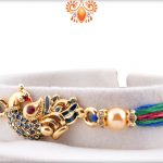 Dazzling Combination Of Golden And Blue Peacock Rakhi With Colorful Thread Rakhi 6