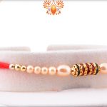 Simple yet Elegant Design with White Pearl Beads Rakhi