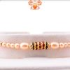 Simple yet Elegant Design with White Pearl Beads Rakhi 5