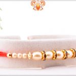 Exclusive White Pearl Rakhi with Red Thread 6