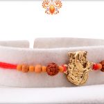 Antique Metal Base Golden Ganpati With Wooden Beads And Rudraksha Rakhi