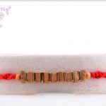 Handcrafted Square Sandalwood and Golden Beads Rakhi 5