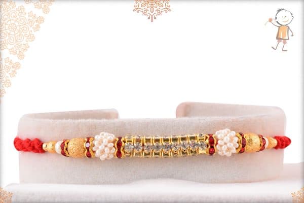 Glowy Diamond Rakhi with Pearls and Golden Beads