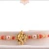Golden Ganesh Rakhi with Red Beads 3