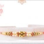 Simple Golden Rakhi with Red Diamonds 3
