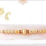Golden Bead Rakhi with Diamond Rings 3