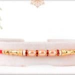 Stunning Pearl Rakhi with Golden Beads and Diamond 3