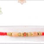 Uniquely Knotted Sandalwood Diamond Rakhi with Golden Beads 3