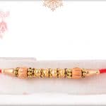 Traditional Sandalwood Diamond Rakhi Golden Beads 3