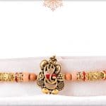 Ganesh Sandalwood Diamond Rakhi with Golden Beads 3