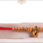 Divine Golden Ganeshji Rakhi with Sandalwood Beads - Babla Rakhi