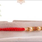 Uniquely Knotted Royal Pearl Rakhi with Diamond Rings - Babla Rakhi