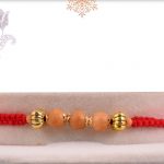 Uniquely Knotted Sandalwood Bead Rakhi with Golden Beads - Babla Rakhi