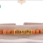 Delicate Golden OM with Sandalwood Beads Rakhi - Babla Rakhi