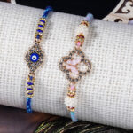 Premium Evil Eye Bhaiya Rakhi with Pastel Pink Bhabhi Rakhi