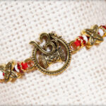 Stunning OM Rakhi with Designer Beads