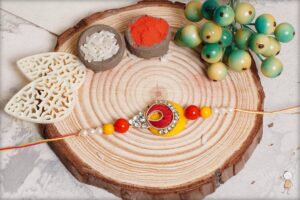 Beautiful Pearls Traditional Rakhi With Mauli Thread